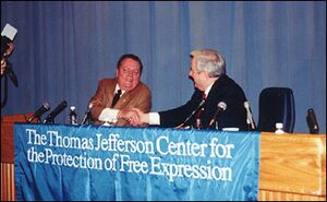 Falwell, on the right (of course) shakes hands with Larry Flynt during a conference on Falwell v. Flynt and Hustler Magazine